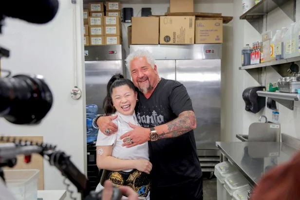 Host Guy Fieri with chef Mei Lin, owner of  Daybird, located in Los Angeles, as seen on Diners Drive-Ins and Dives, Season 38.