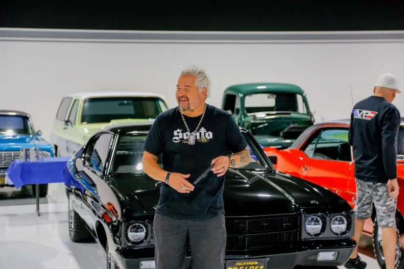 Host Guy Fieri beams as he explores VP Speed Shop: a 25,000 square foot state-of-the-art vintage car showroom and custom hot rod shop, located in Santa Rosa, CA, as seen on Diners, Drive-In's and Dives: Revved Up.