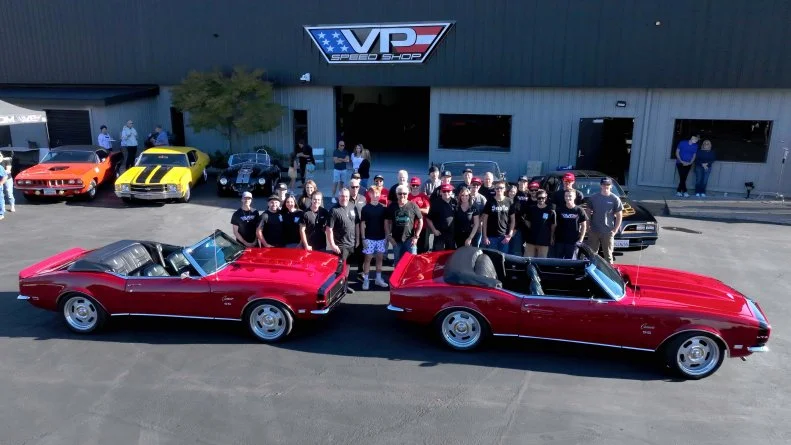 Host Guy Fieri stands with youngest son, Ryder Fieri and the VP Speed Shop Team in Santa Rosa, California, as seen on Diners, Drive-In's and Dives: Revved Up.