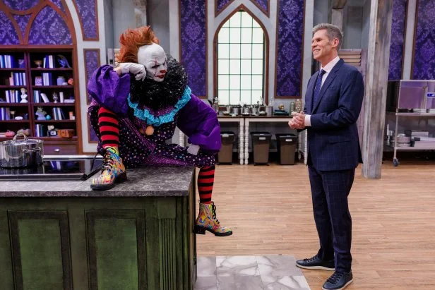 Host John Henson and Judge Stephanie Boswell, as seen on Halloween Baking Championship, Season 11.