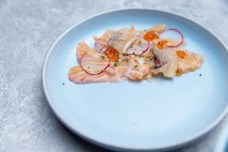 salmon sashimi with hizu and a yuzu miso vinaigrette