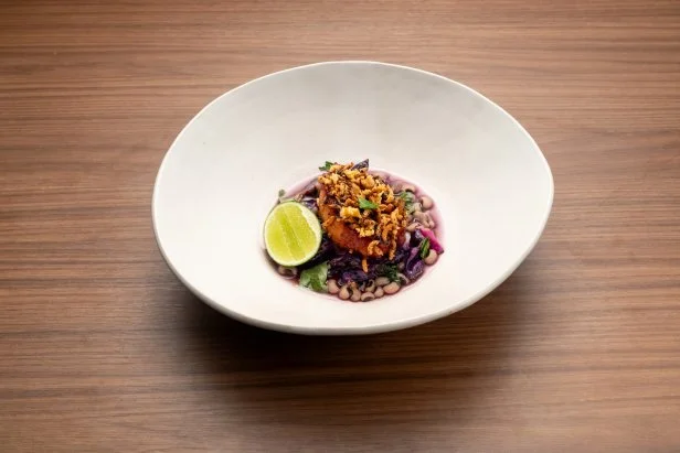 Titan Brooke Williamson's Round 3 dish, pork and beans with a bacon cabbage broth, pineapple doubanjiang glaze, and crispy garlic rice, as seen on Bobby's Triple Threat, Season 3.