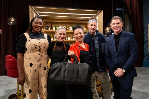 Chef Shirley Chung holding the $25,000 prize money with Titans Tiffany Derry, Brooke Williamson, and Michael Voltaggio and Host Bobby Flay, as seen on Bobby's Triple Threat, Season 3.