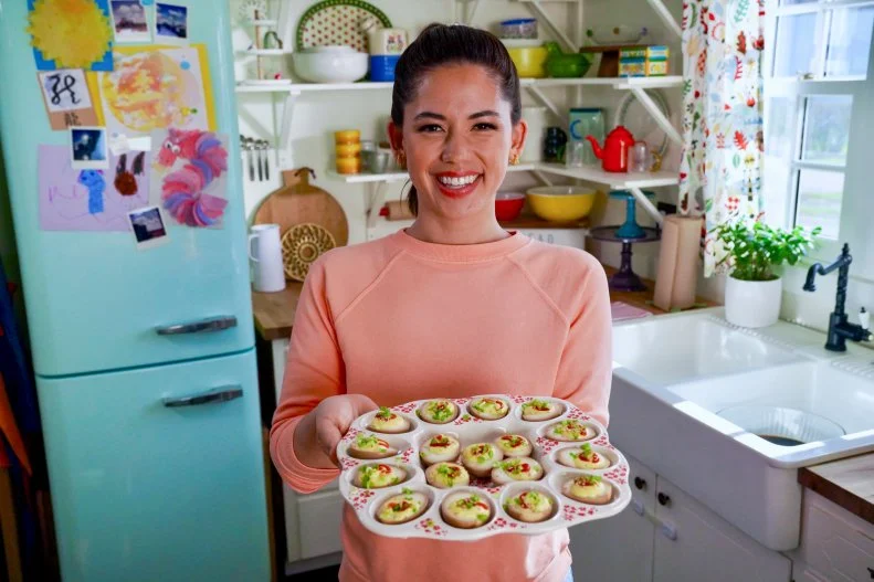 Portrait of Molly Yeh with her Soy Sauce Deviled Eggs, as seen on Girl Meets Farm Season 14