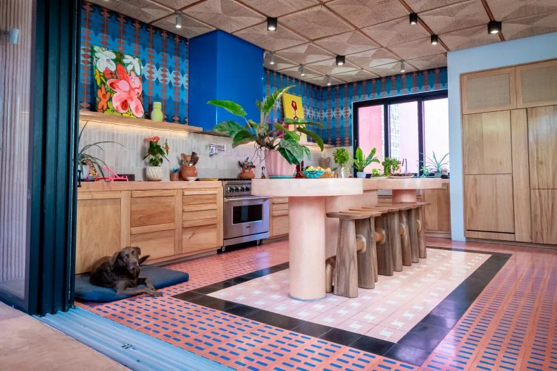 Rick is clearly a fan of pattern and the bolder the better. The upstairs kitchen continues his love of craftsmanship in everything from the floor time to the wooden stools.