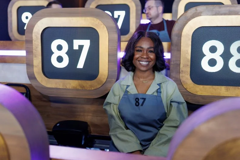 100 Cooks contestant Clarice “Rece” Eze sits in the stands