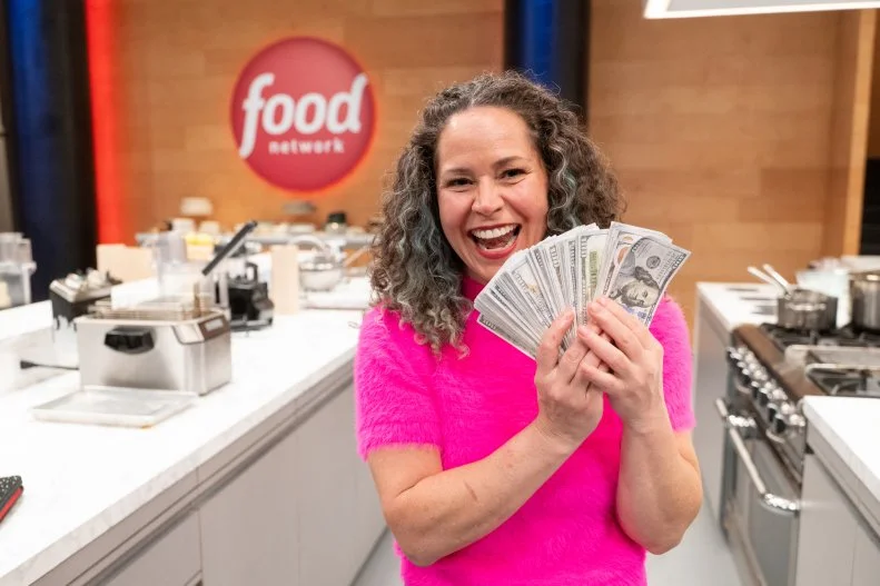 Stephanie Izard celebrates winning the most money, as seen on Wildcard Kitchen, Season 3.