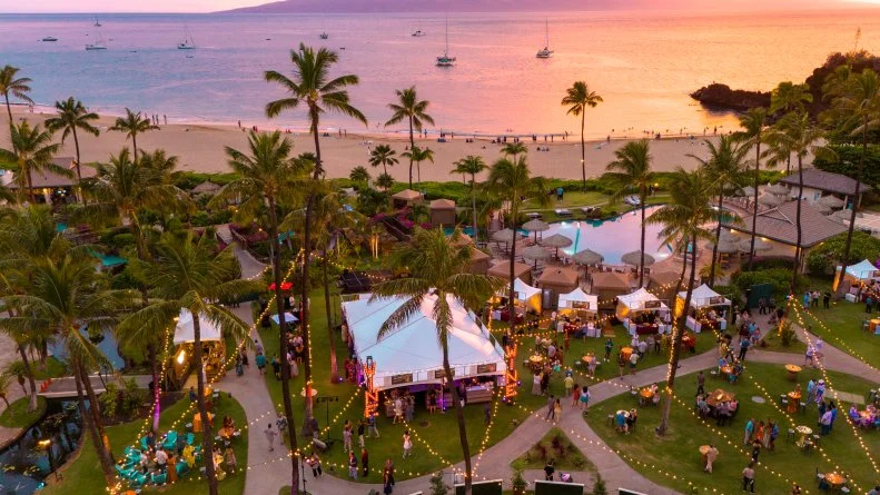 Sunset over the Hawaii Food and Wine Festival tents 