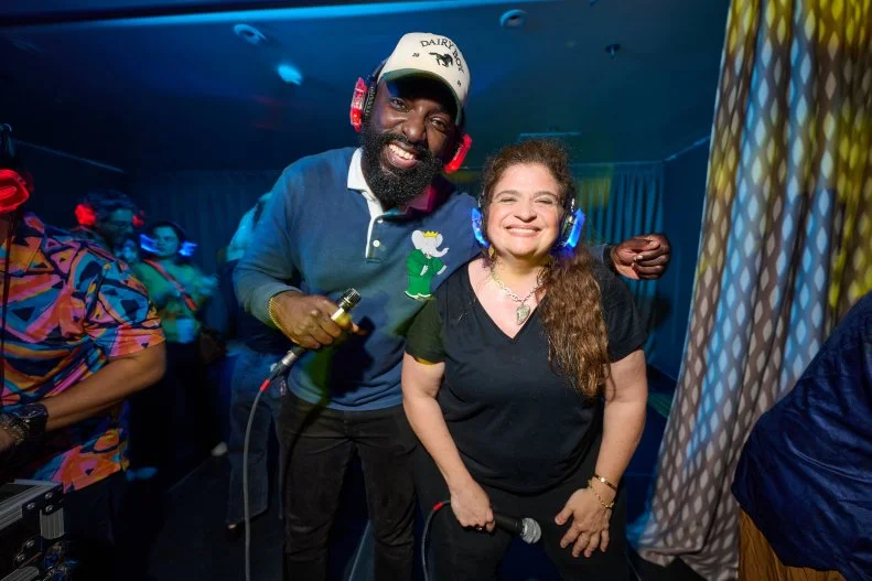 Chefs Alex Guarnaschelli and Eric Adjepong posing at Chefs Making Waves in 2025