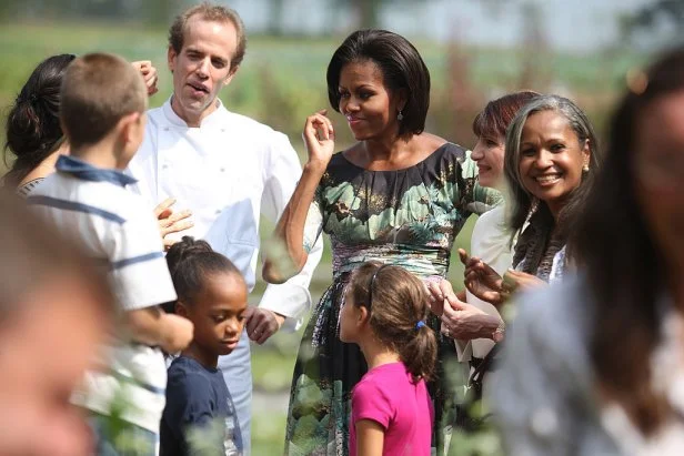 POCANTICO HILL, NY -  SEPTEMBER 24: U.S. First Lady Michelle Obama, Colombian First Lady Maria Clemencia Rodriguez De Santos (2nd R), Haitian First Lady Elisabeth D. Preval (R), and Executive Chef of Blue Hill restaurant Dan Barber (4th R) talk with students from JFK Magnet School and Pocantico Hills Central School at Stone Barns Center for Food and Agriculture on September 24, 2010 in Pocantico Hills, Westchester county, New York. The visit is part of the First Lady's healthy eating program. 