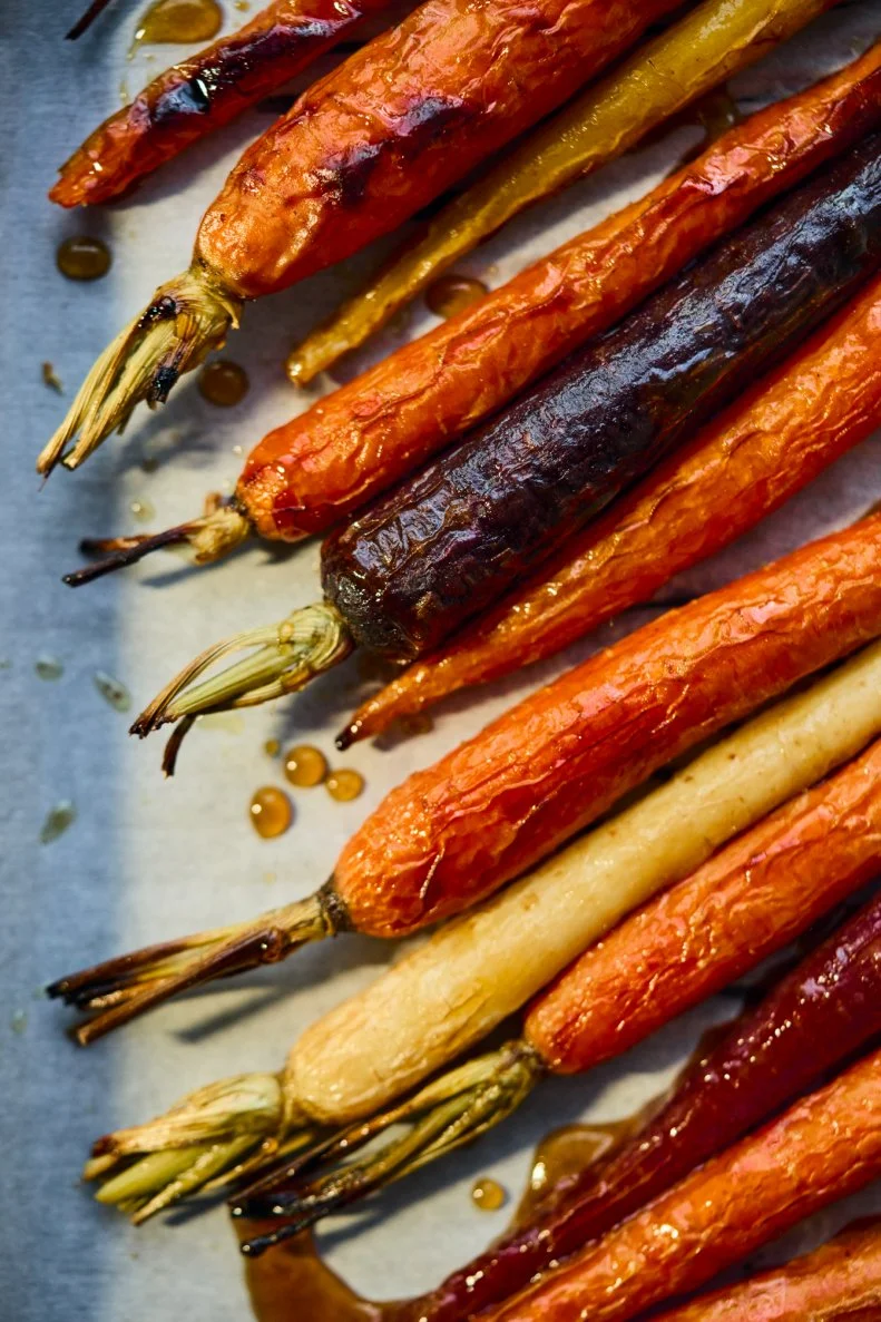 A close-up of Maple Glazed Roasted Carrots made by Kardea Brown, author of Make Do With What You Have