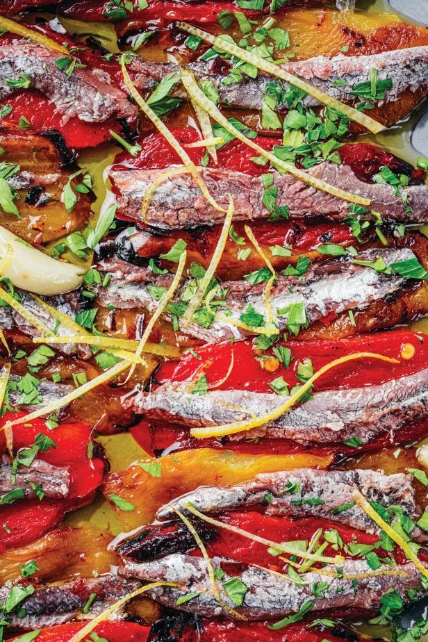 Sliced anchovies and peppers with herbs and citrus.