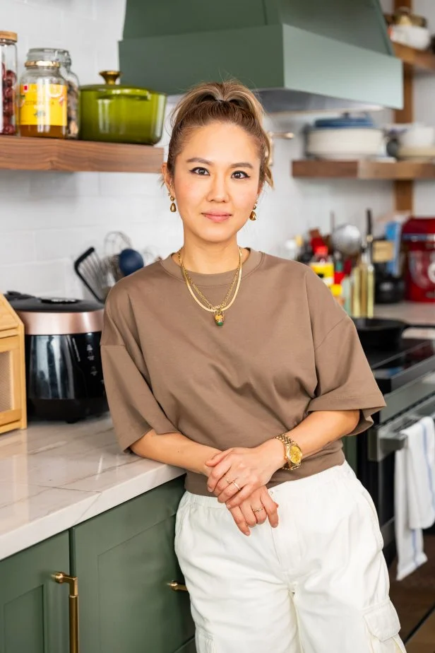 Host Esther Choi posed on set, as seen on Cooking with Choi.