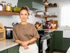 Host Esther Choi posed on set, as seen on Cooking with Choi.