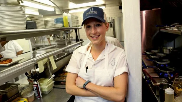 Chef and Buttermilk Kitchen owner Suzanne Vizethann in a kitchen as seen on Food Network's Triple D Nation, Season 6.