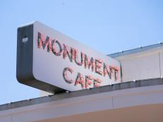 Exterior sign at Monument Cafe in Austin, Texas, as seen on Food Network's Triple D Nation, season 8.