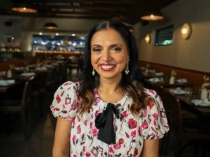 Maneet Chauhan smiling at camera