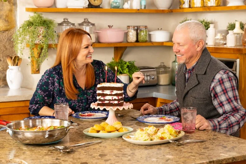 Ladd and Ree Drummond with a birthday cake