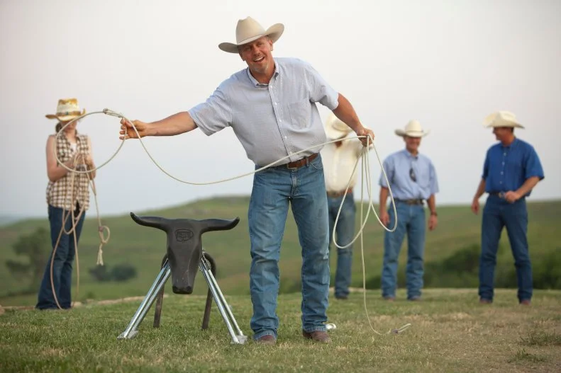 Ladd Drummond practicing roping on a fake calf.