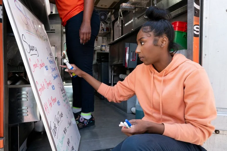 Stuph'd's Dionne making the menu for the final sales challenge