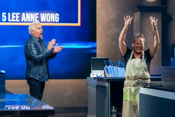 Host Guy Fieri with winning contestant Lee Anne Wong after the West B Matchup, as seen on Tournament of Champions, Season 5.