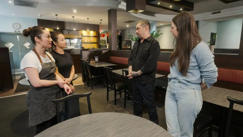 Jen Agg and Aaron Sanchez with Jeanette L and Joanna L standing to discuss in resturant before new design
