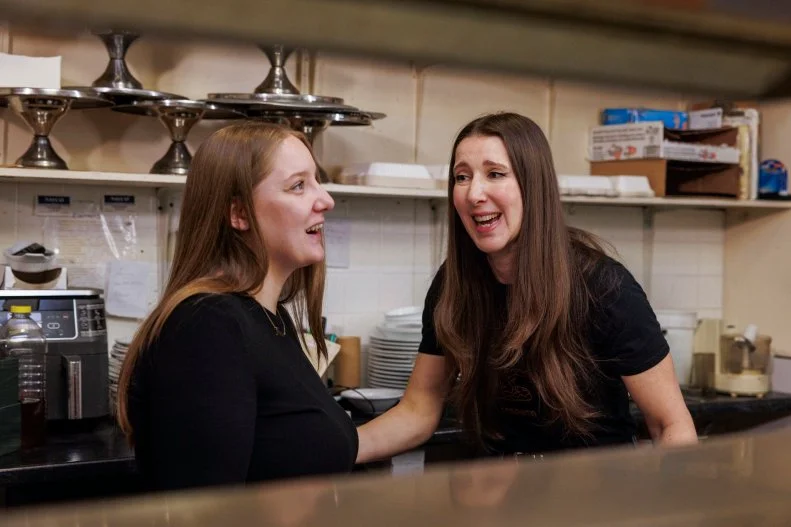 Jen Agg and Jenna N laughing together in the kitchen