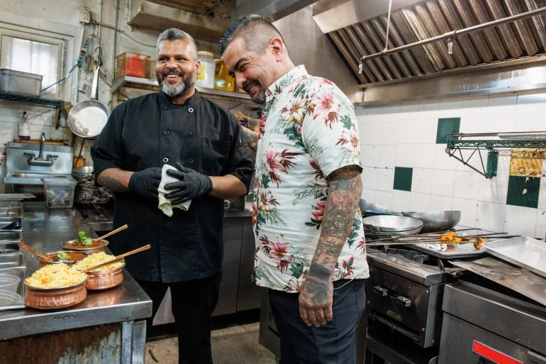 Aaron Sanchez laughing with Johny V in the kitchen