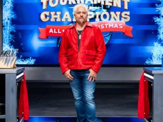 Host Guy Fieri poses, as seen on Tournament of Champions: All-Star Christmas, Season 2.