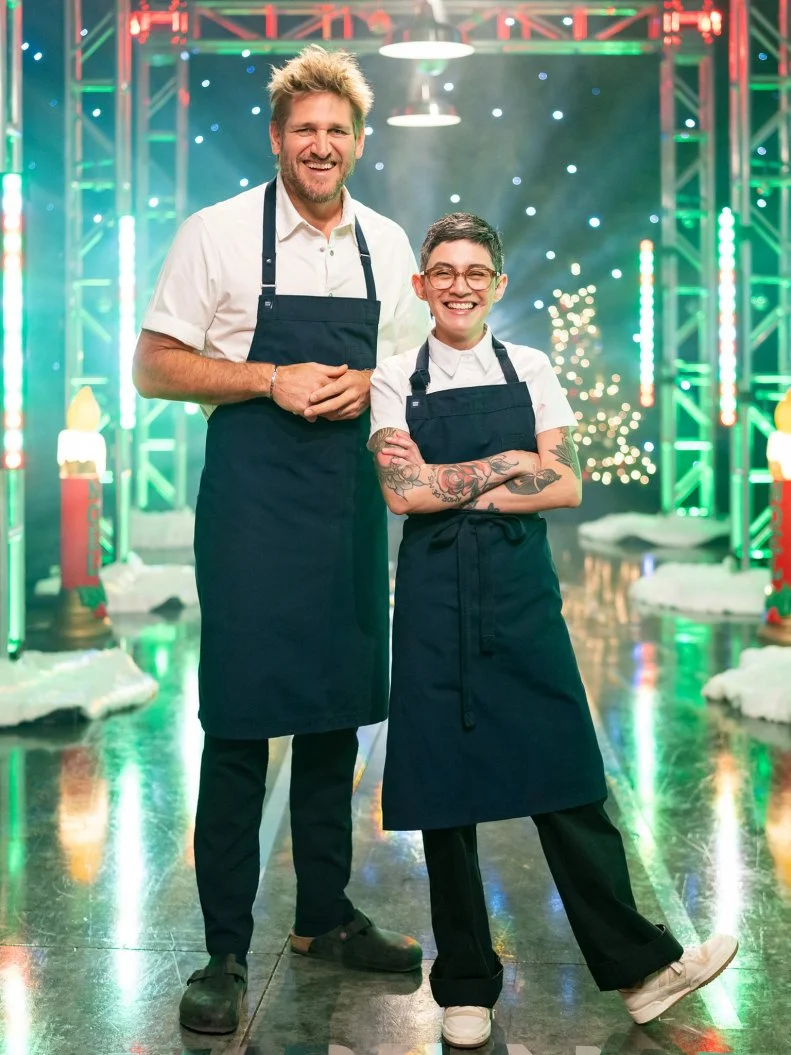 Contestants Curtis Stone and Mitzi Reyes pose, as seen on Tournament of Champions: All-Star Christmas, Season 2.