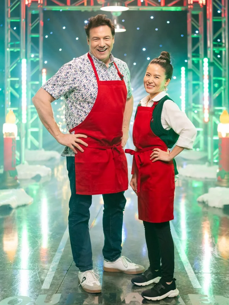 Contestants Rocco DiSpirito and Grace Pak pose, as seen on Tournament of Champions: All-Star Christmas, Season 2.