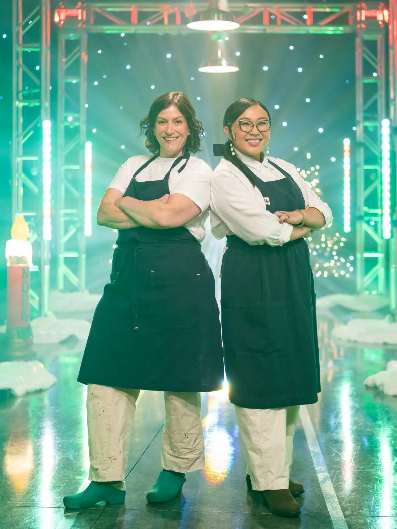 Contestants Sara Bradley and Nini Nguyen pose, as seen on Tournament of Champions: All-Star Christmas, Season 2.