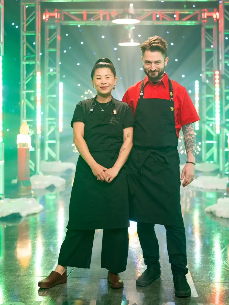 Contestants Mei Lin and Alex Stupak pose, as seen on Tournament of Champions: All-Star Christmas, Season 2.