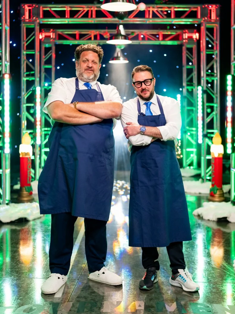 Contestants Aaron May and Adam Sobel pose, as seen on Tournament of Champions: All-Star Christmas, Season 2.
