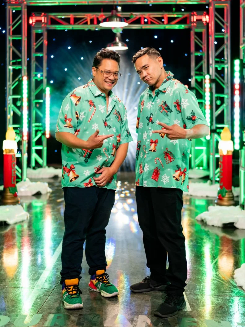Contestants Aaron May and Adam Sobel pose, as seen on Tournament of Champions: All-Star Christmas, Season 2.