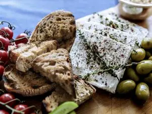 Close-up of Easy Mezze Board and Marinated Herbed Feta, as seen on Be My Guest with Ina Garten, Season 8