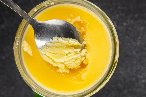 Ghee butter or clarified butter delicious gourmet food background on the table rustic food top view copy space keto and paleo diet vegetarian and vegan food