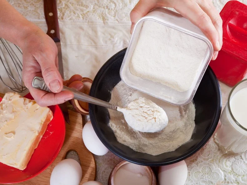 Closeup of cook hands making  dough with flour