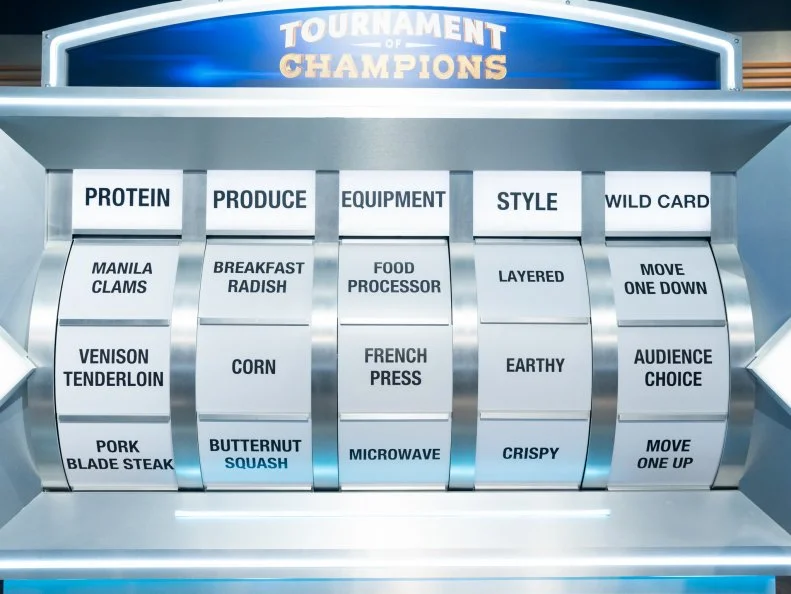 The Randomizer for Contestants Lee Anne Wong and Stephanie Izard, features venison tenderloin protein, corn produce, French press equipment, Earthy style, and audience choice wild card, as seen on Tournament of Champions, Season 7.