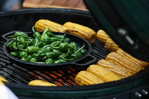 Barbecue Summer Time And Healthy Eating. Grilled Vegetables, Organic Corn And Green Sweet Mini Peppers Cooking With Smoke At The Street Food Kiosk, Full Frame, Ambient Light, Copy Space