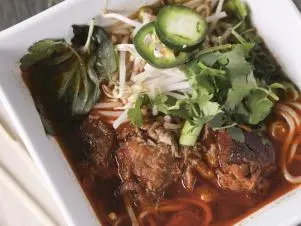 Mexi-Pho as prepared by Chef/Owner Amy Le at Saucy Porka in Chicago, Illinois, as seen on Food Network's Triple D Nation, season 8.