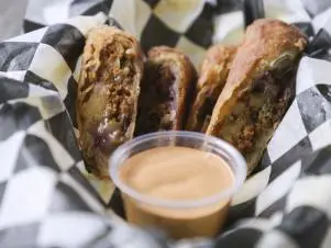 Picadillo Egg Rolls as prepared by Chef/Owner Pete Le at Saucy Porka in Chicago, Illinois, as seen on Food Network's Triple D Nation, season 8.