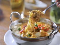 A classic Cuban baked rice dish layered like a casserole&mdash;comforting, rich and flavorful, finished with melted cheese.