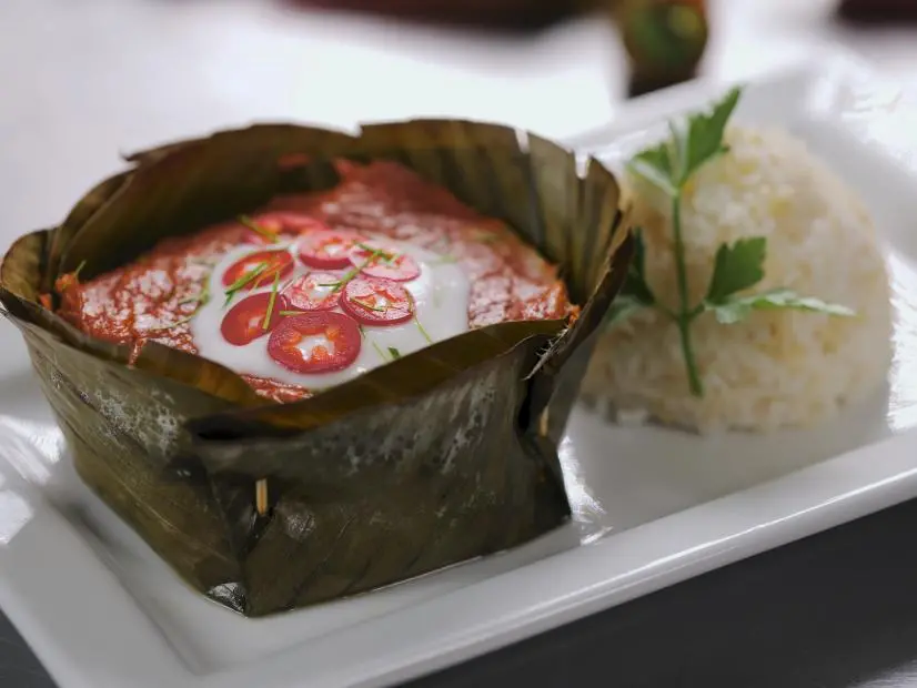 Amok as prepared by Chef/Owner Channy Laux at Angkor Chef in San Jose, California, as seen on Food Network's Diners Drive-Ins and Dives, season 42.