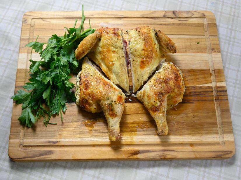 Host Rachael Ray's garlic and herb cheesy chicken, as seen on Food Network.