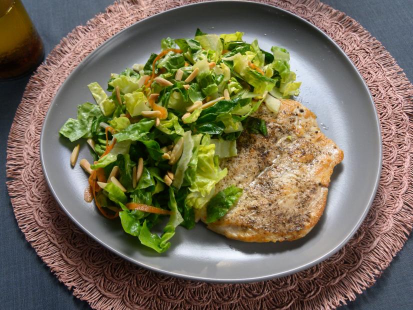 Host Rachael Rays chicken paillard with gem salad and toasted almonds, as seen on Food Network.