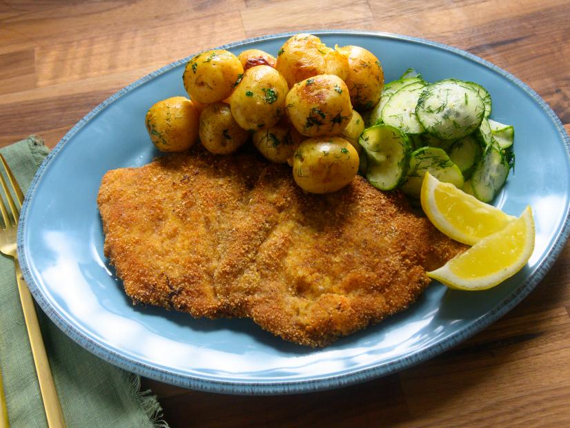 Host Rachael Ray's pork cutlets with German cucumber salad, as seen on Food Network.