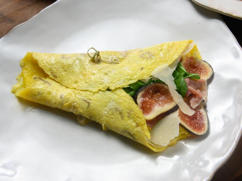 Host Rachael Ray's croque madame egg crepes with gluten free bechamel, as seen on Food Network.