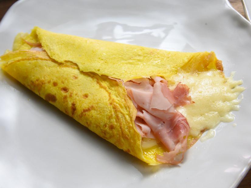 Host Rachael Ray's croque madame egg crepes with gluten free bechamel, as seen on Food Network.