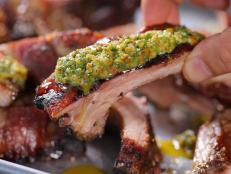 Argentinean preparation is simple but is all about the cooking technique. These ribs cook better on a rotisserie as they self-baste for maximum flavor and juiciness. If you're going to cook this recipe on a grill, add some charcoal or hardwood to add more flavor to the ribs. If you do not have a rotisserie set-up, you can simply cook these directly on the grill. Allow the chimichurri to rest at least 2 hours before serving &ndash; this will allow time for the flavors to marry together. The chimichurri is a delicious spread that adds a zest to any Argentinian style dish, and this makes a great topping for the slow roasted ribs. This can also be a great topping for grilled chicken breast, lamb or fish.